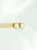 Pozłacane kolczyki z perłowym oczkiem w geometrycznej oprawie