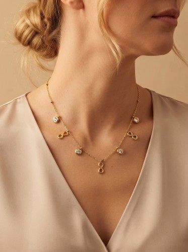 Przejdź do produktu Stalowy naszyjnik w kolorze złota z motywem nieskończoności i cyrkoniami